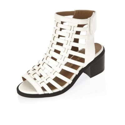 Girls white caged heel shoes